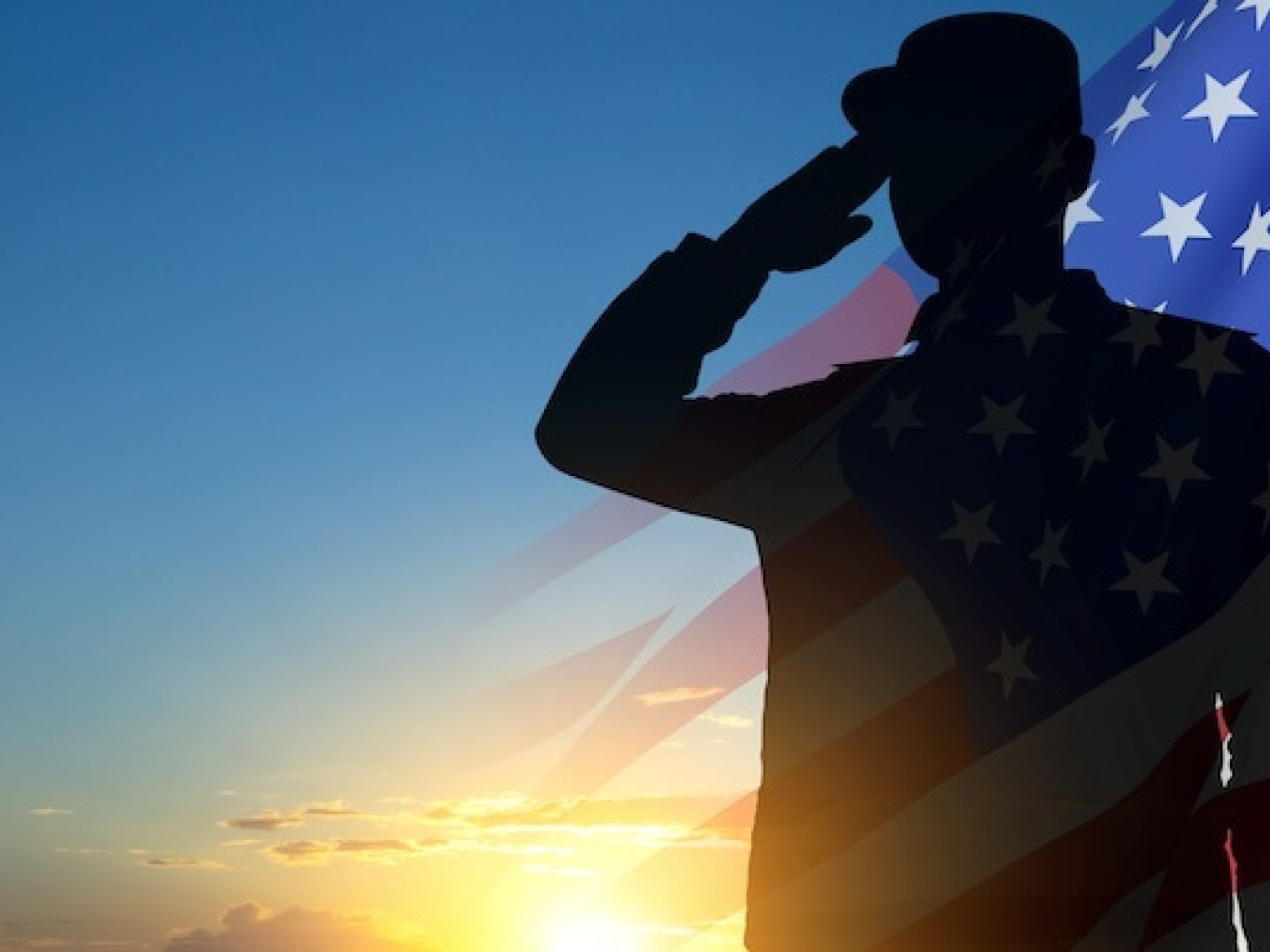 Silhouette of a man in front of an American flag.