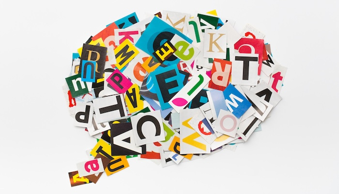 Cut out magazine letters form a colorful speech bubble.