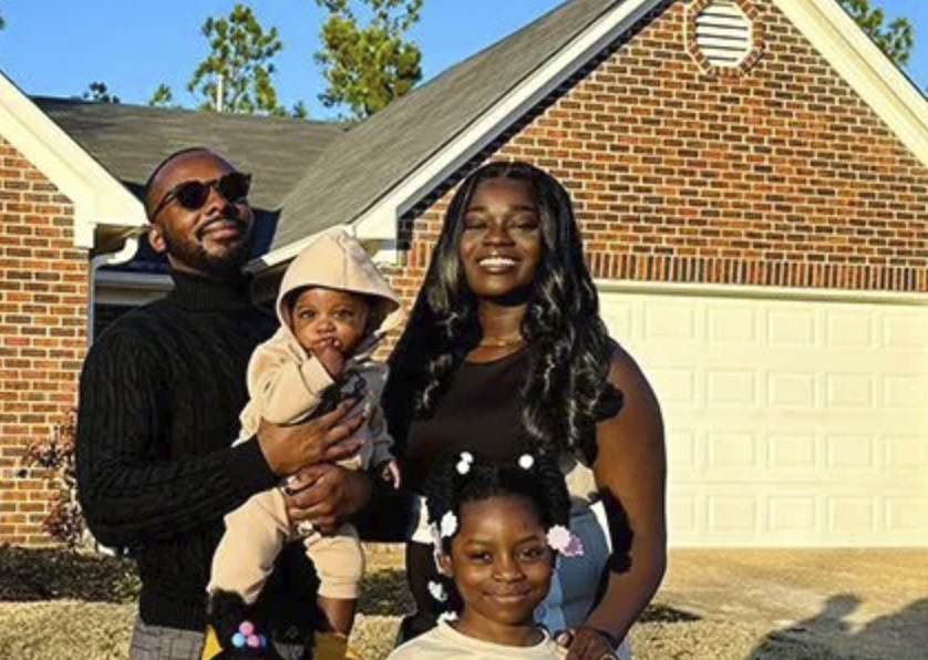 picture of Santonio W. in front of a house