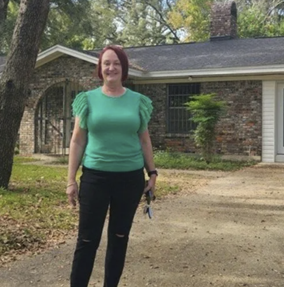 picture of Lisa J. in front of a house